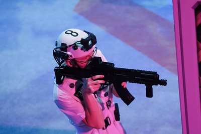 Player #8 aiming through sight in purple light
