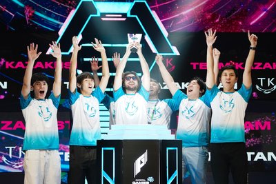 Team Kazakhstan with trophy on Phygital Games podium