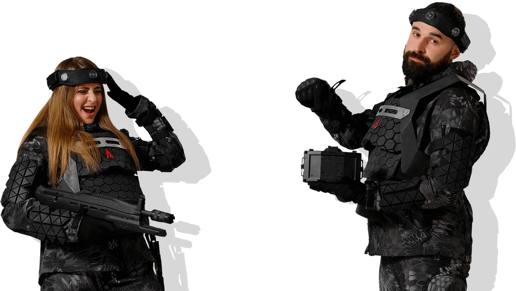 Two laser tag players wearing head sensors and holding LASERWAR equipment