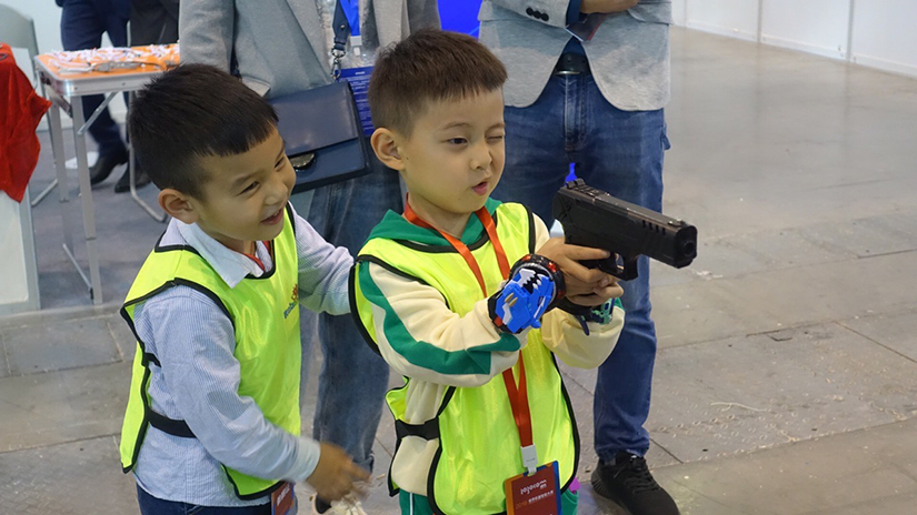 children with a laser tag gun