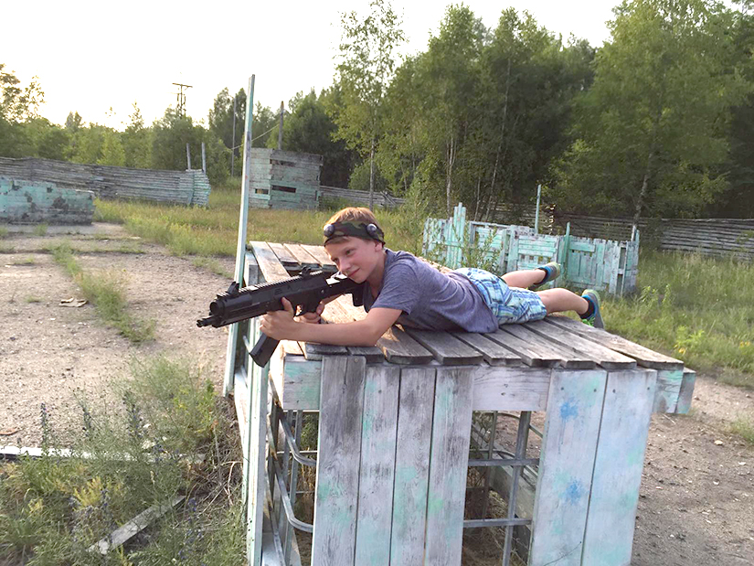 child with a laser tag AK-12LT Predator